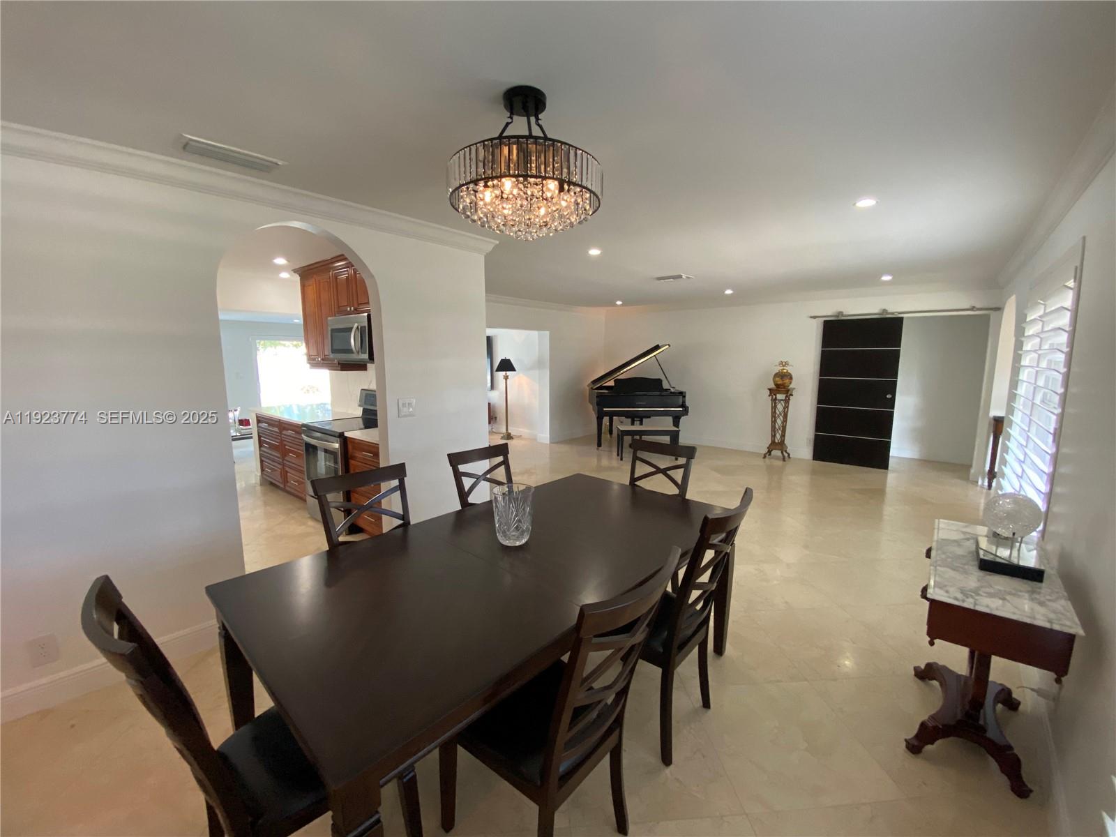 6611 Northeast 21st Lane Fort Lauderdale, FL 33308 - Photo 7 of 32 a view of a dining room with furniture