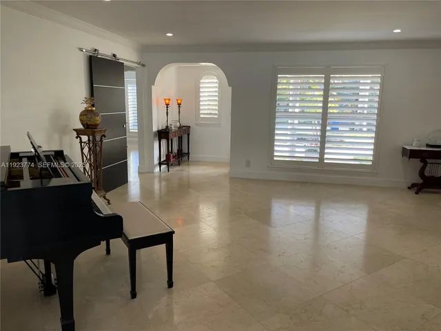 a view of a room with furniture window and wooden floor