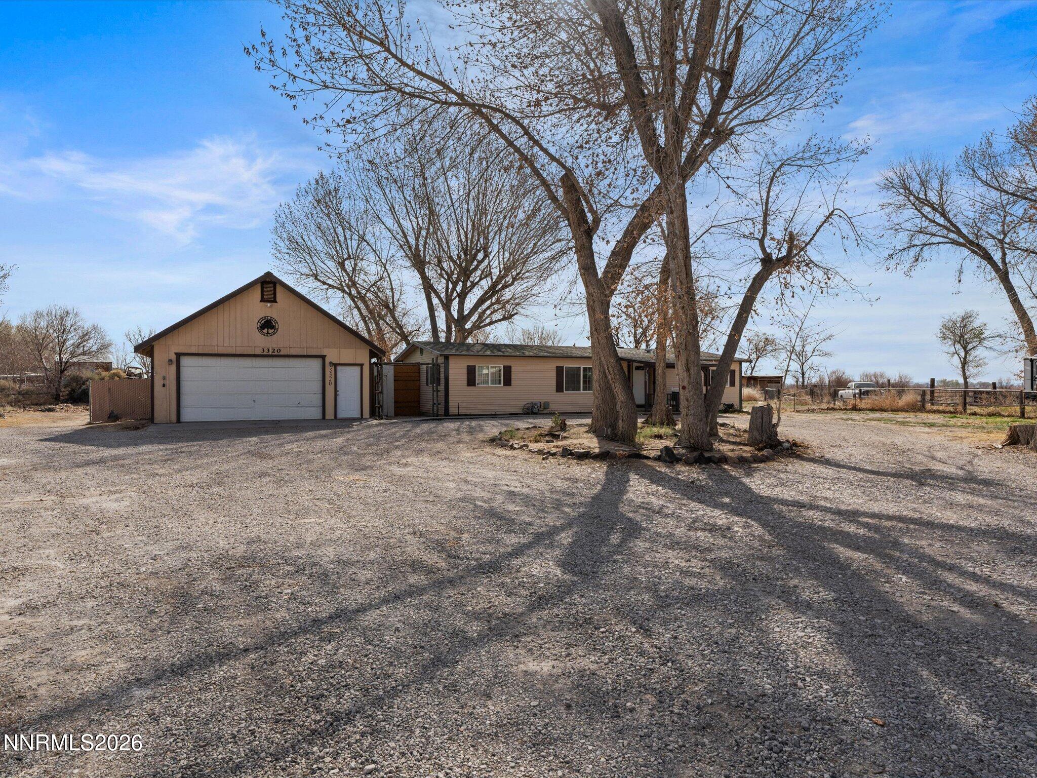3320 Della Circle Fallon, NV 89406 - Photo 4 of 31 a front view of a house with a yard covered in snow