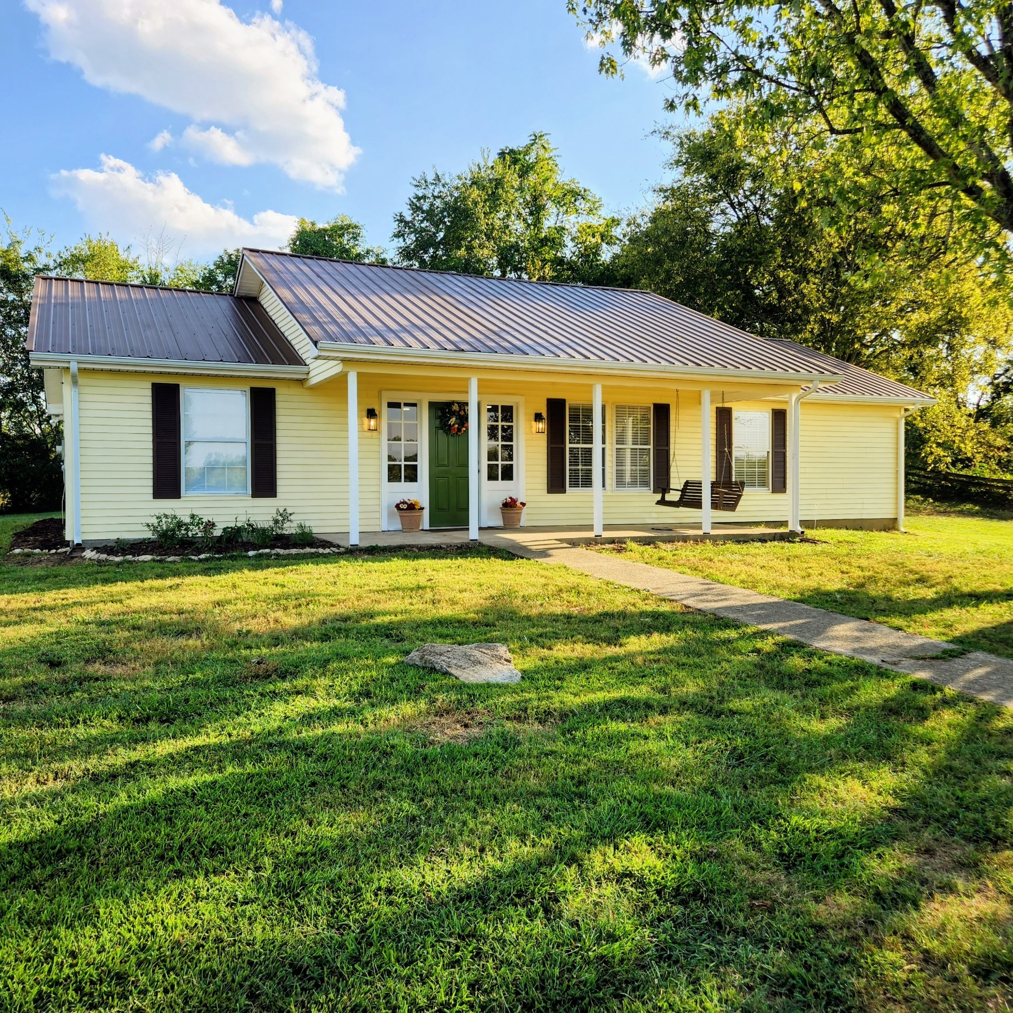 a front view of a house with a yard