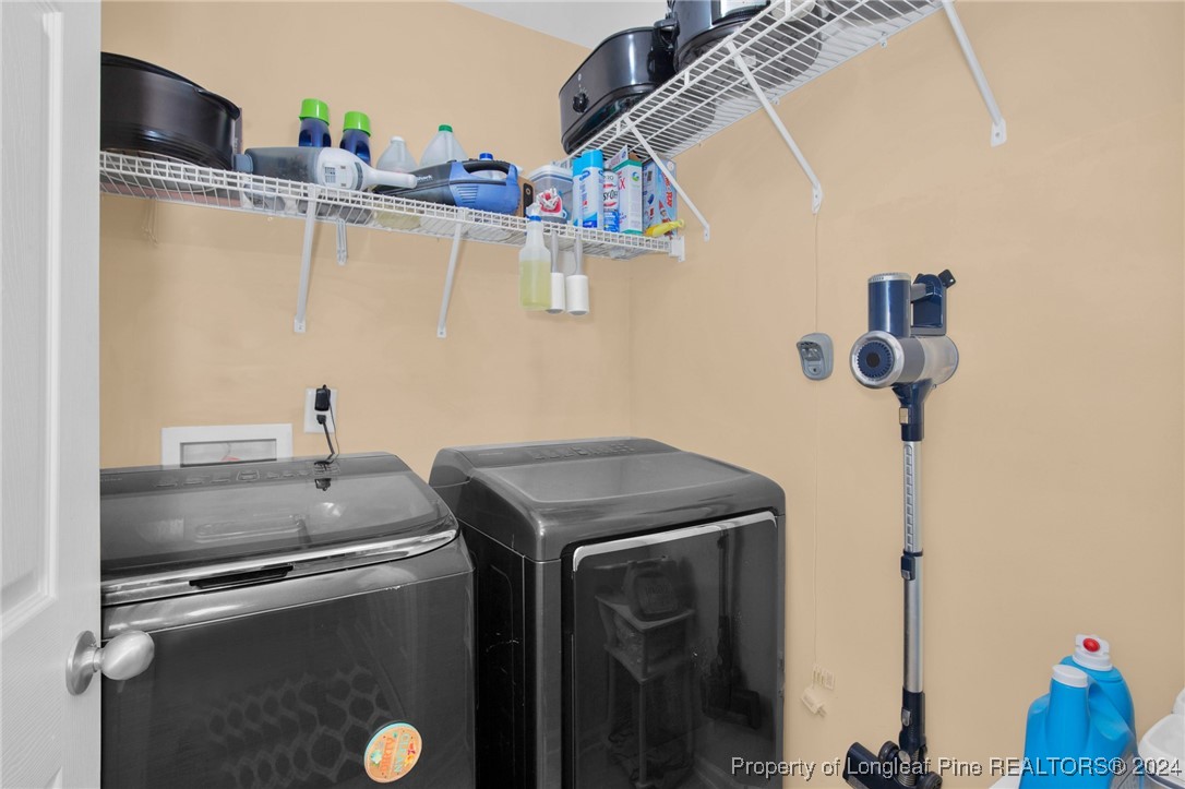 2124 Yellowbrick Road Fayetteville, NC 28314 - Photo 16 of 30 a utility room with dryer and washer