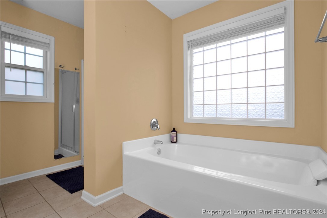 2124 Yellowbrick Road Fayetteville, NC 28314 - Photo 20 of 30 a white bath tub sitting next to a window