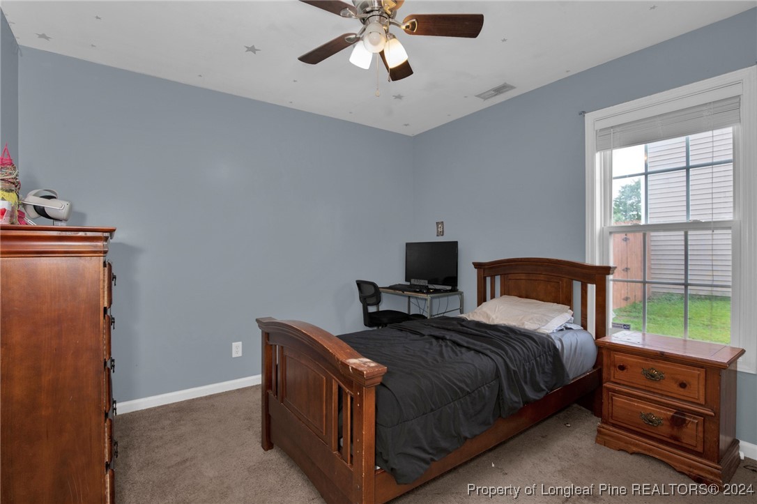2124 Yellowbrick Road Fayetteville, NC 28314 - Photo 22 of 30 a bedroom with a bed and a window