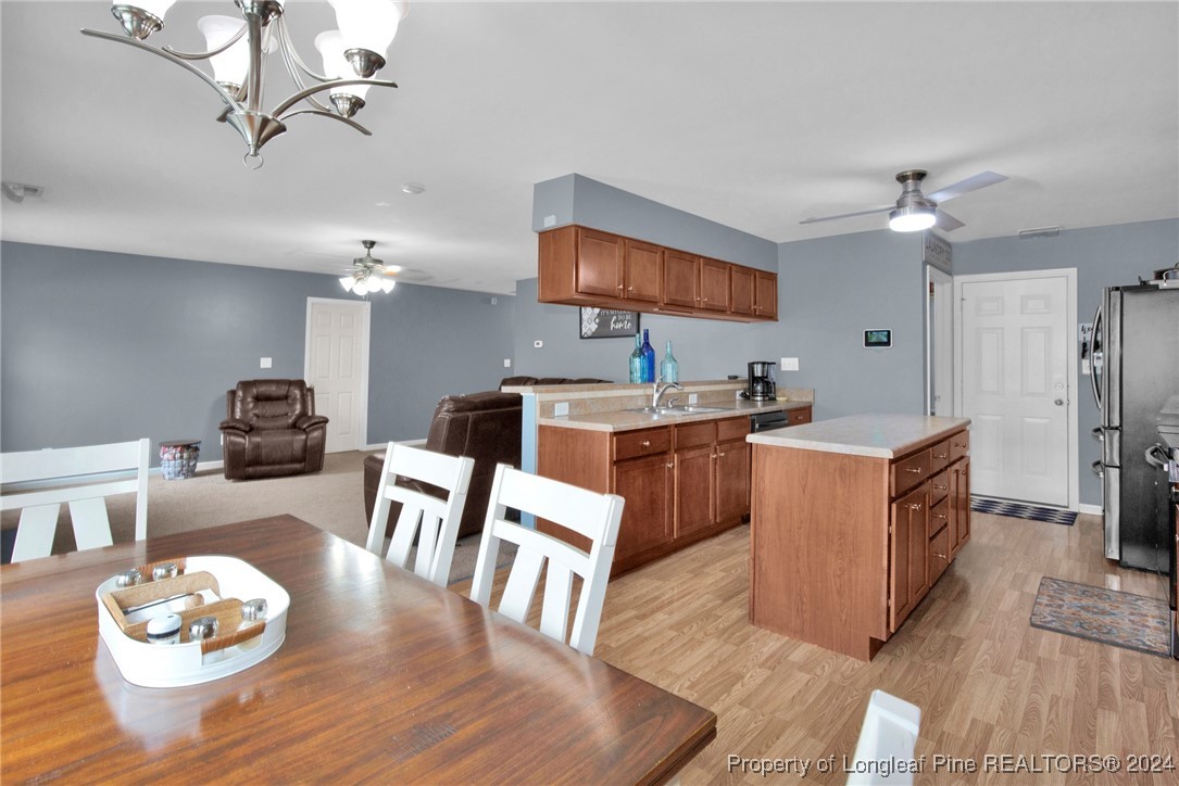 2124 Yellowbrick Road Fayetteville, NC 28314 - Photo 10 of 30 a living room with stainless steel appliances kitchen island granite countertop furniture and a kitchen view