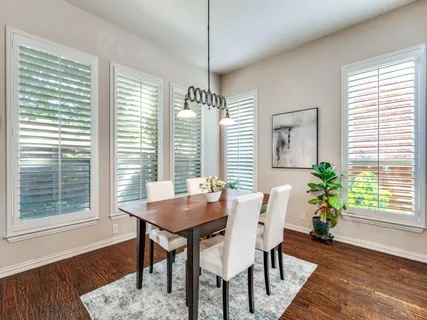 a dining room with furniture window wooden floor