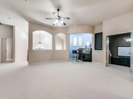 a view of a livingroom with furniture and a chandelier