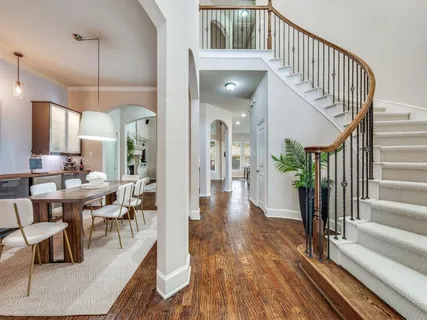 a view of a living room and dining room