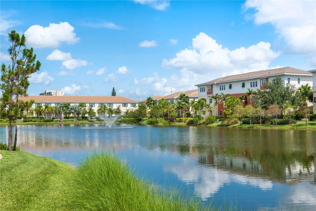 a view of a lake with a house in the background