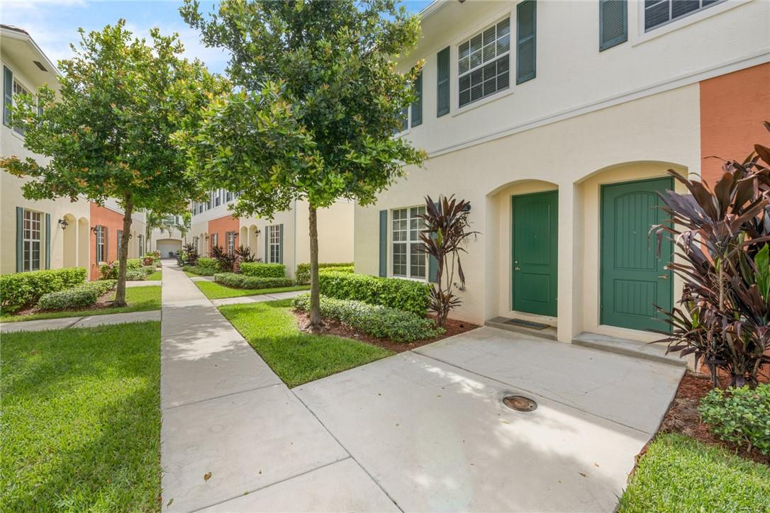 710 Southwest 1st Way Pompano Beach, FL 33060 - Photo 14 of 38 a view of a house with a yard and potted plants