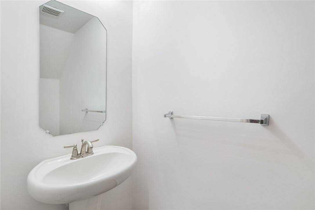 710 Southwest 1st Way Pompano Beach, FL 33060 - Photo 22 of 38 a bathroom with a sink and a mirror