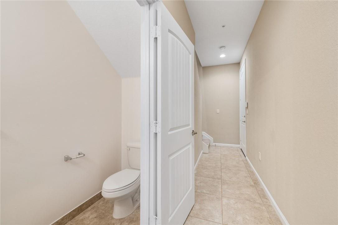 710 Southwest 1st Way Pompano Beach, FL 33060 - Photo 23 of 38 a bathroom with a granite countertop toilet and a shower