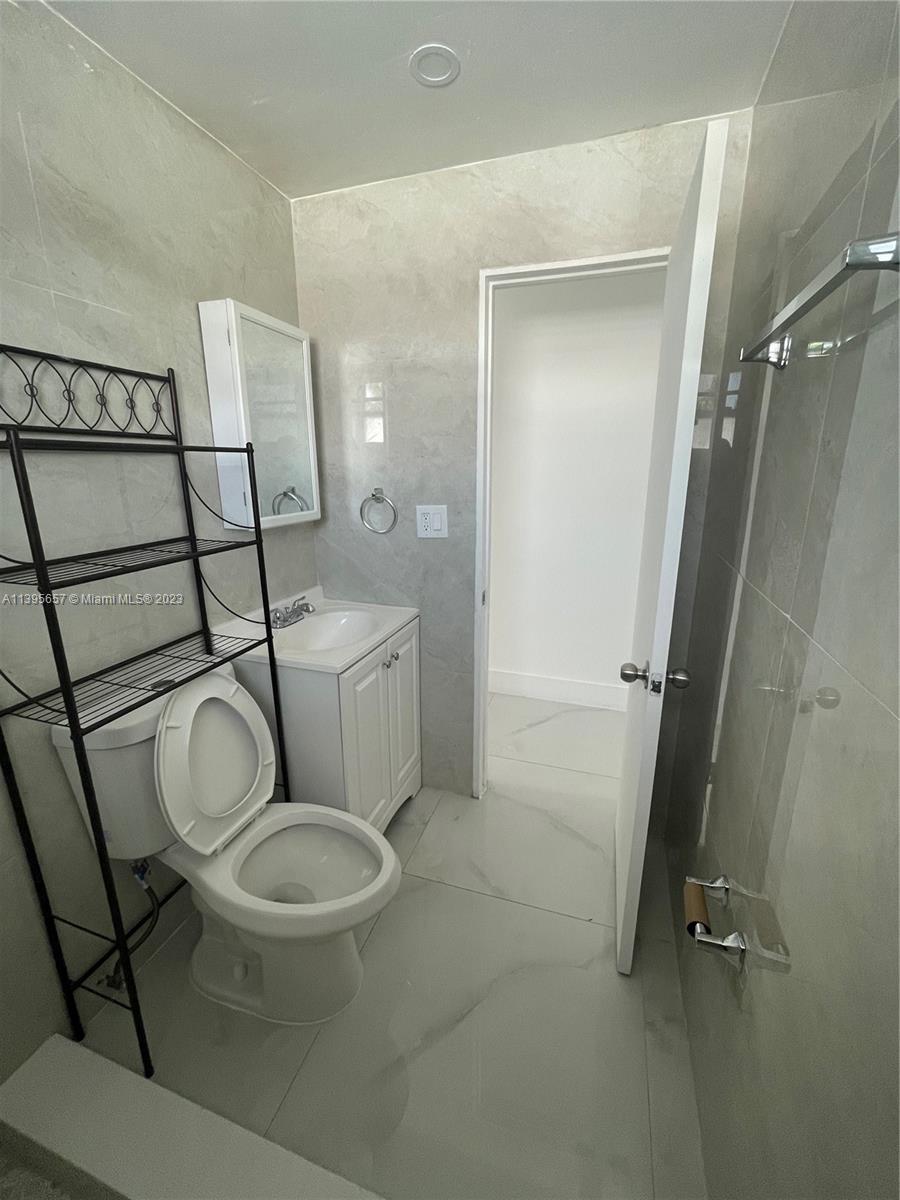685 East 9th Lane Hialeah, FL 33010 - Photo 19 of 47 a bathroom with a toilet and a sink