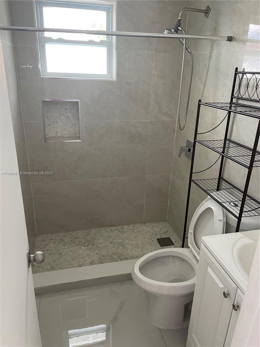 685 East 9th Lane Hialeah, FL 33010 - Photo 20 of 47 a bathroom with a toilet and shower