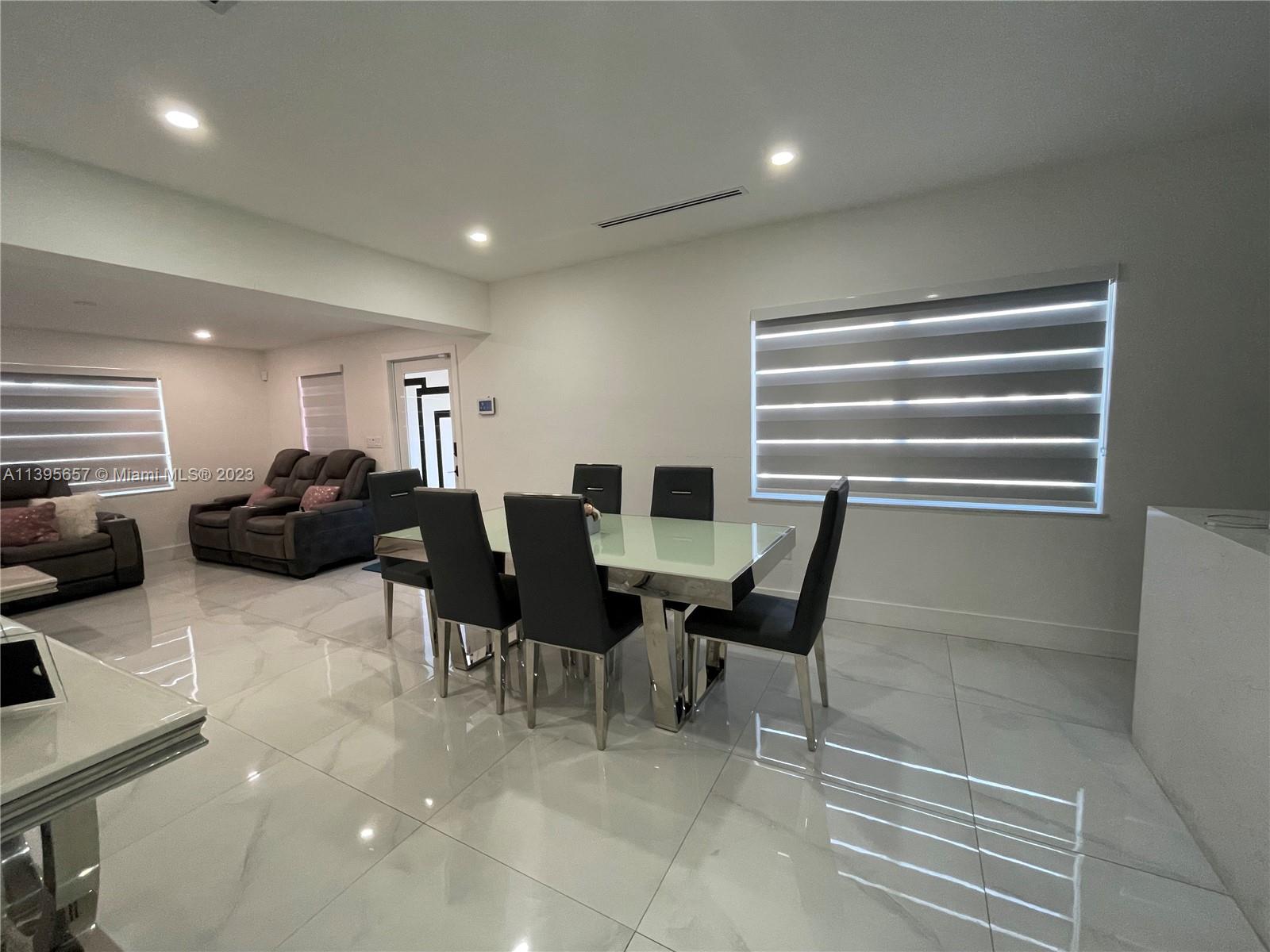 685 East 9th Lane Hialeah, FL 33010 - Photo 46 of 47 a living room with furniture a air conditioner vent and a window