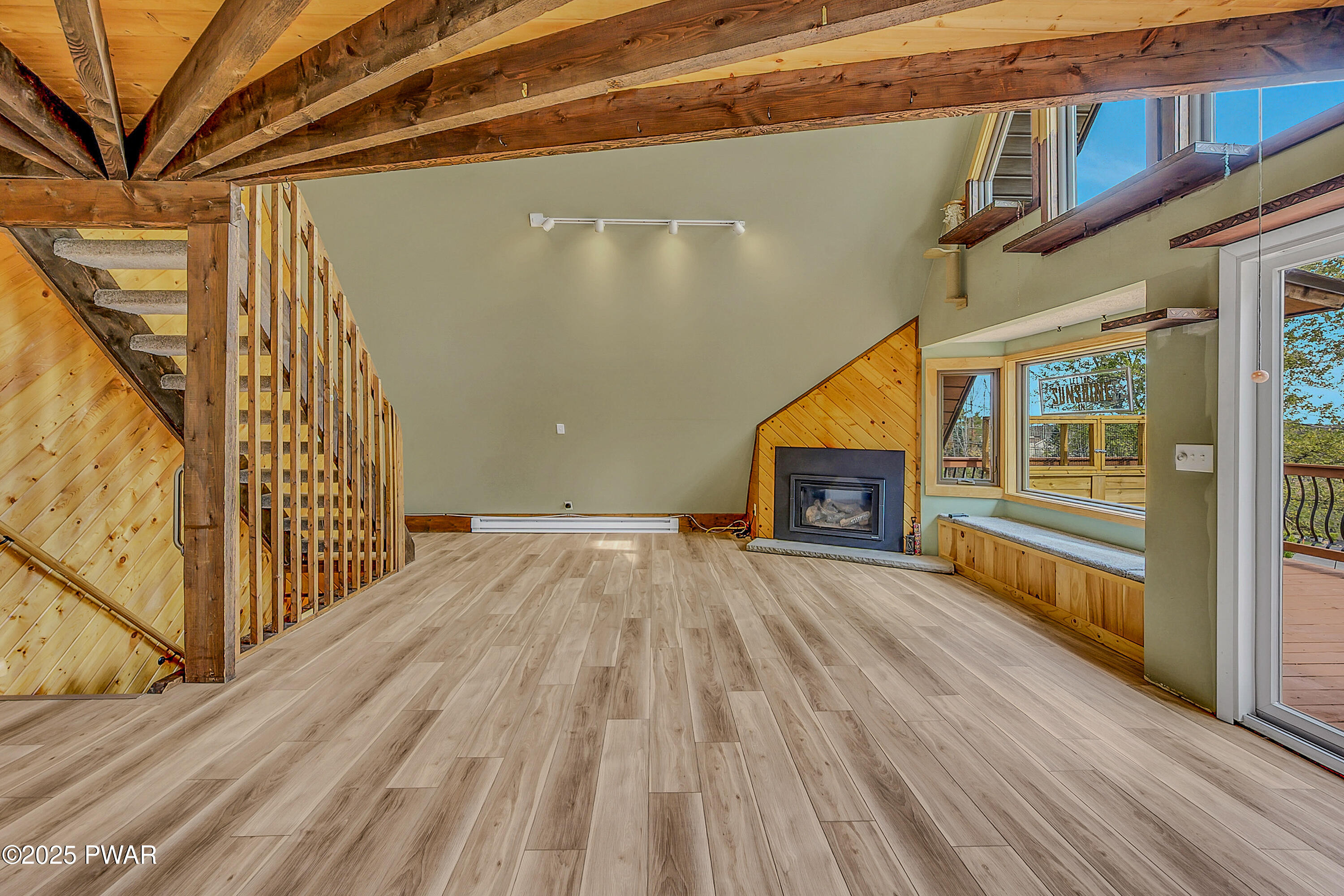 100 Ridgeview Drive Lake Ariel, PA 18436 - Photo 8 of 52 a view of empty room with wooden floor and fireplace