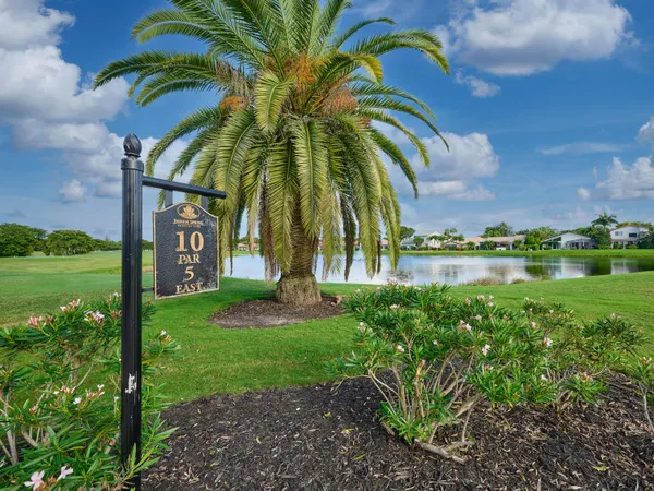 a view of a lake with a yard