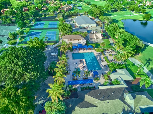 an aerial view of residential houses with outdoor space and street view