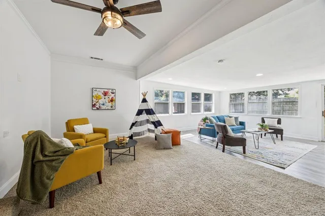 a living room with furniture and a window