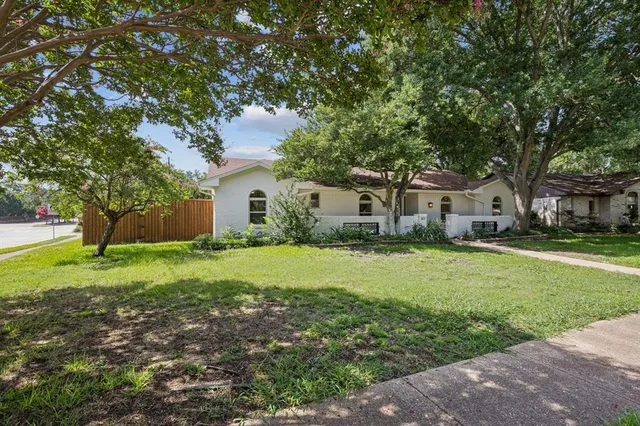 a house view with a garden space