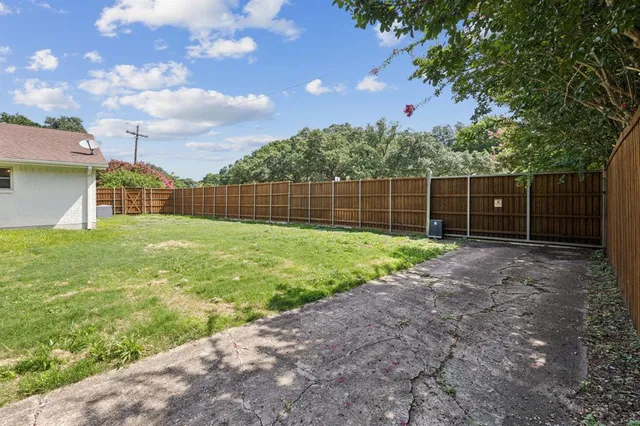 a view of a backyard with a trampoline