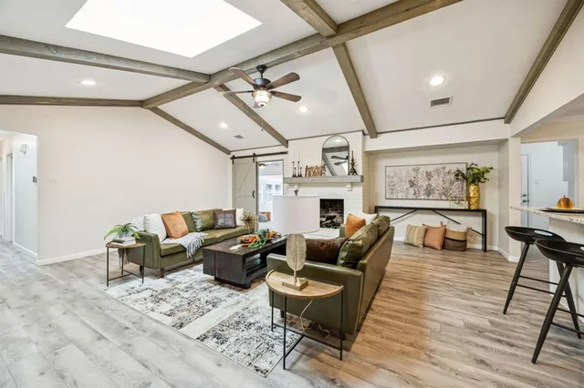 a living room with furniture and fireplace