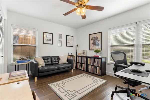 a living room with furniture and a window