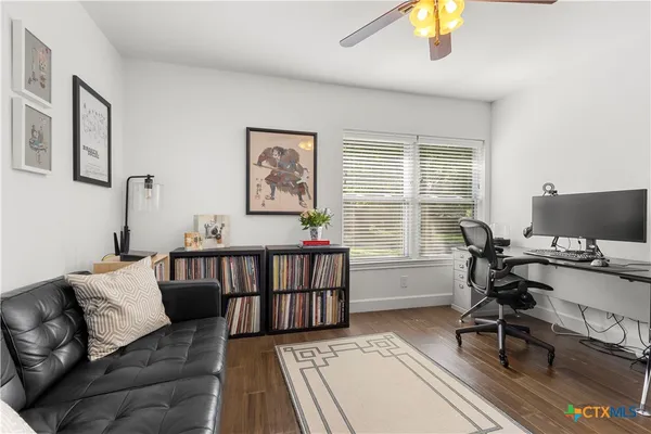 a bedroom with furniture and a window