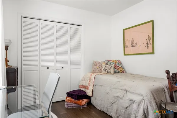 a bedroom with a bed and furniture