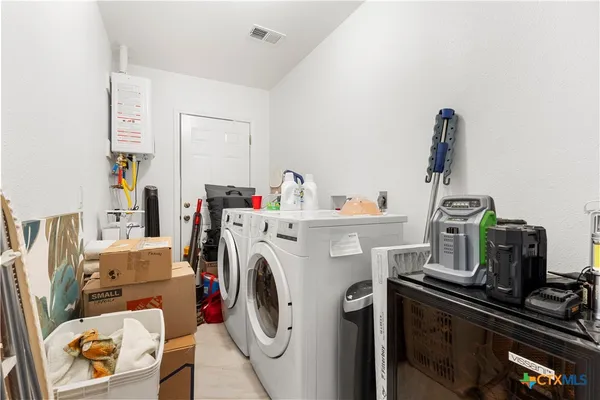a utility room with dryer and washer