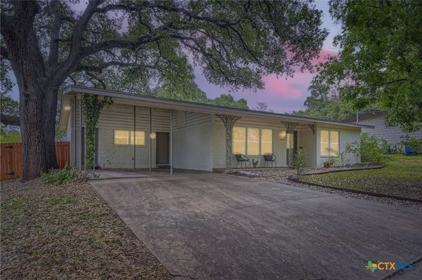 front view of a house with a trees