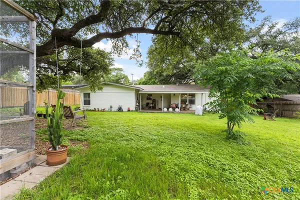 a front view of house with a garden and porch