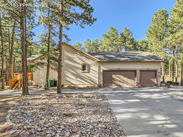 17794 Sawmill Road Colorado Springs, CO 80908 - Photo 28 of 29 Side view of the Home with 3 car Garage