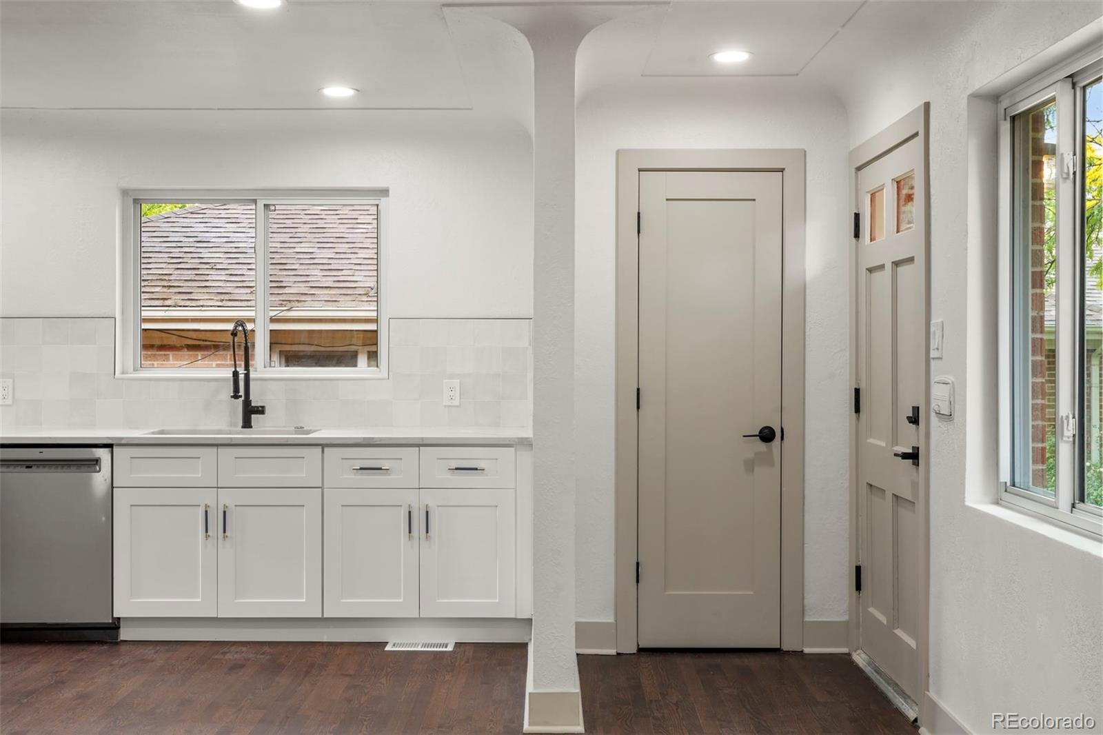 809 Forest Street Denver, CO 80220 - Photo 3 of 15 a bathroom with a sink a vanity and a window