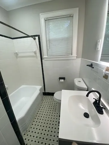 a bathroom with a sink and a shower