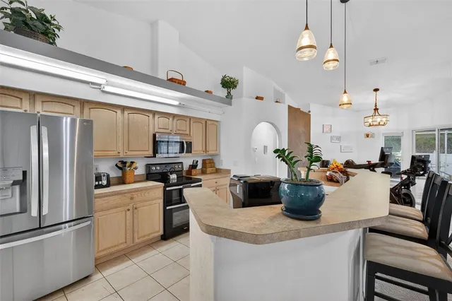 a bedroom with furniture and a chandelier