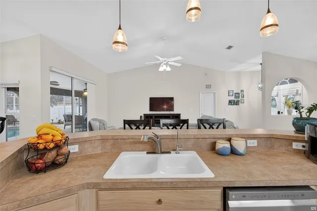 a bedroom with a bed and a television