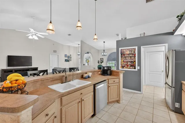 a bathroom with a sink a mirror and a window