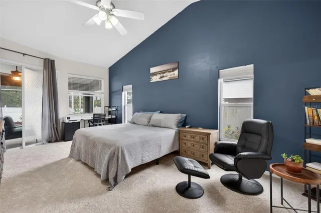 a bathroom with a double vanity sink a mirror and a bathtub