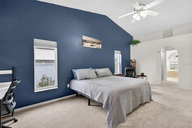 a view of walk in closet with clothes