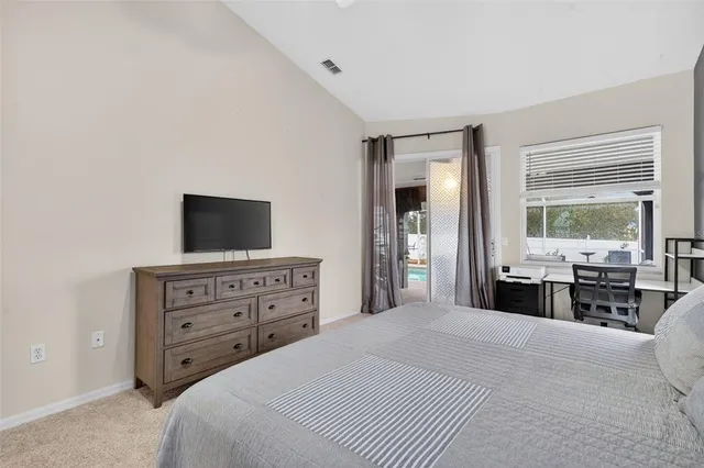 a bathroom with a bathtub a mirror and a shower