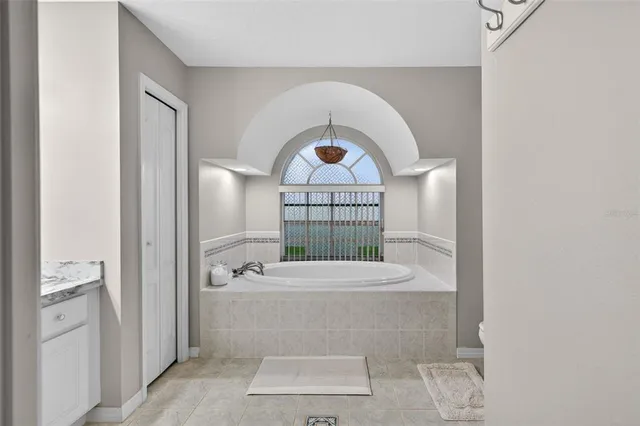 a bathroom with a sink a toilet a shower and a mirror