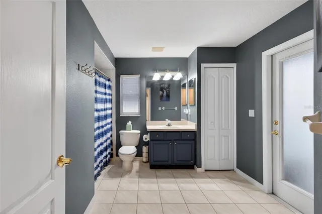 a view of a living room and outdoor kitchen