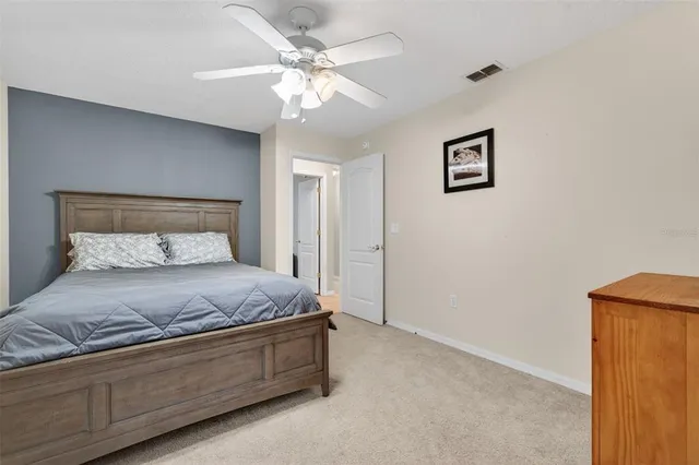 a living room with furniture a dining table and a large window