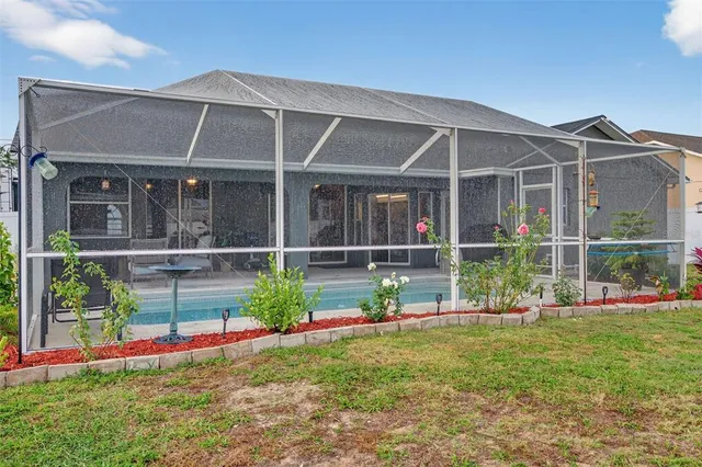 an aerial view of a house with a garden