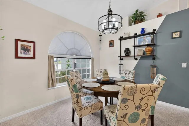 a view of a dining room with furniture window and outside view