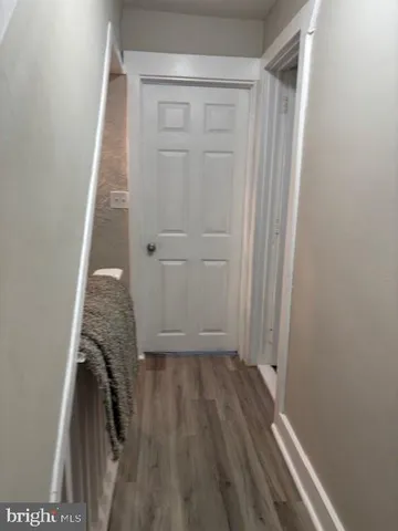 a view of bedroom with wooden floor