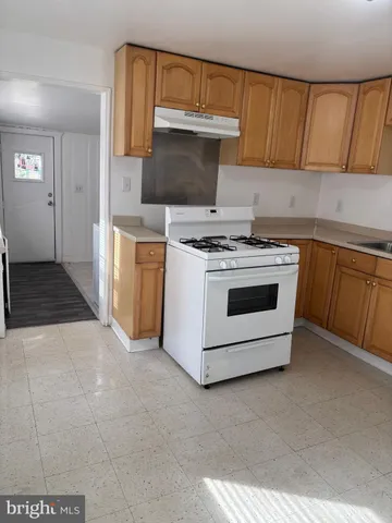 a kitchen with a stove and a microwave