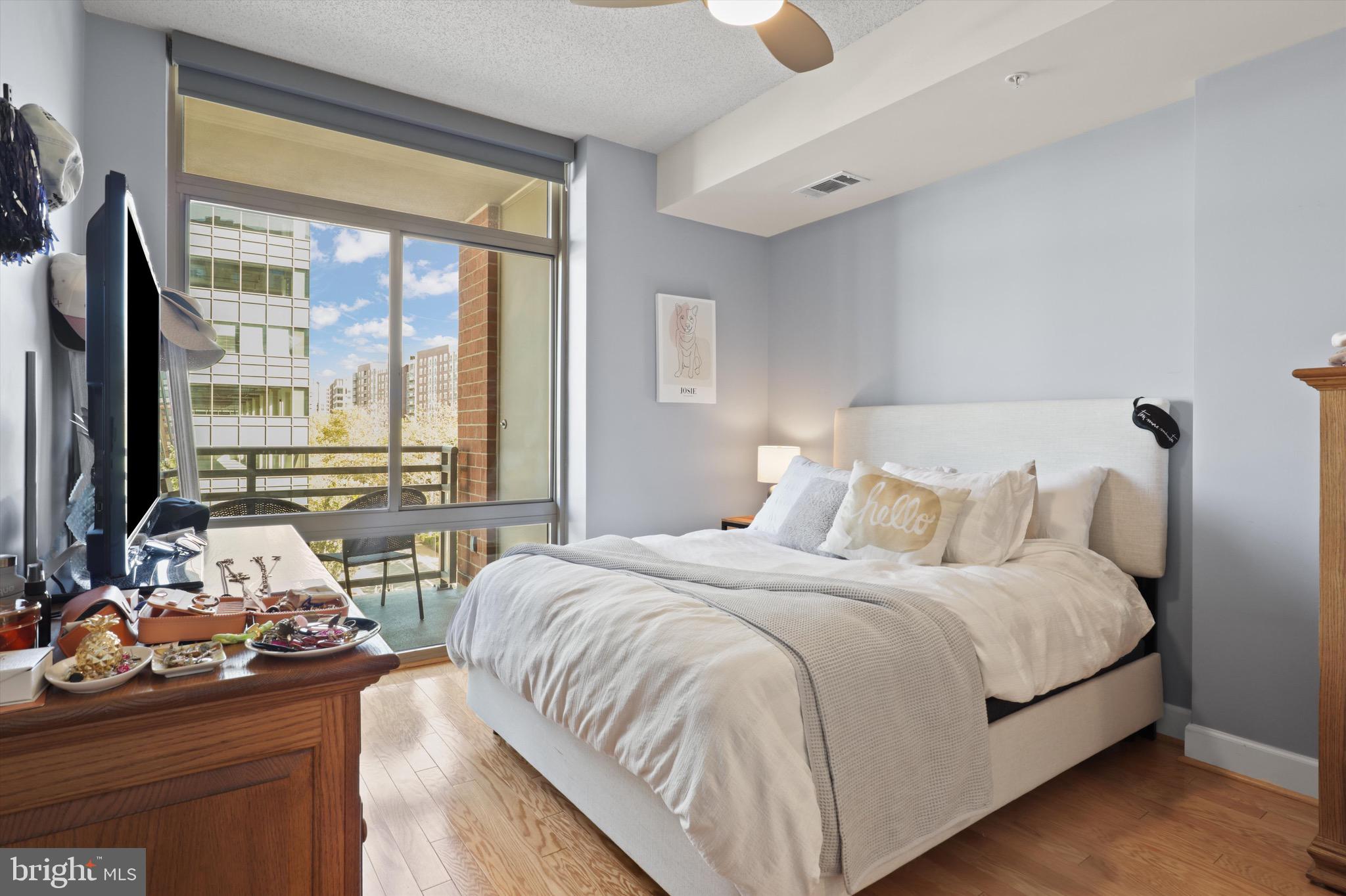 3600 South Glebe Road, Unit 414W Arlington, VA 22202 - Photo 11 of 60 a bedroom with a bed and large windows