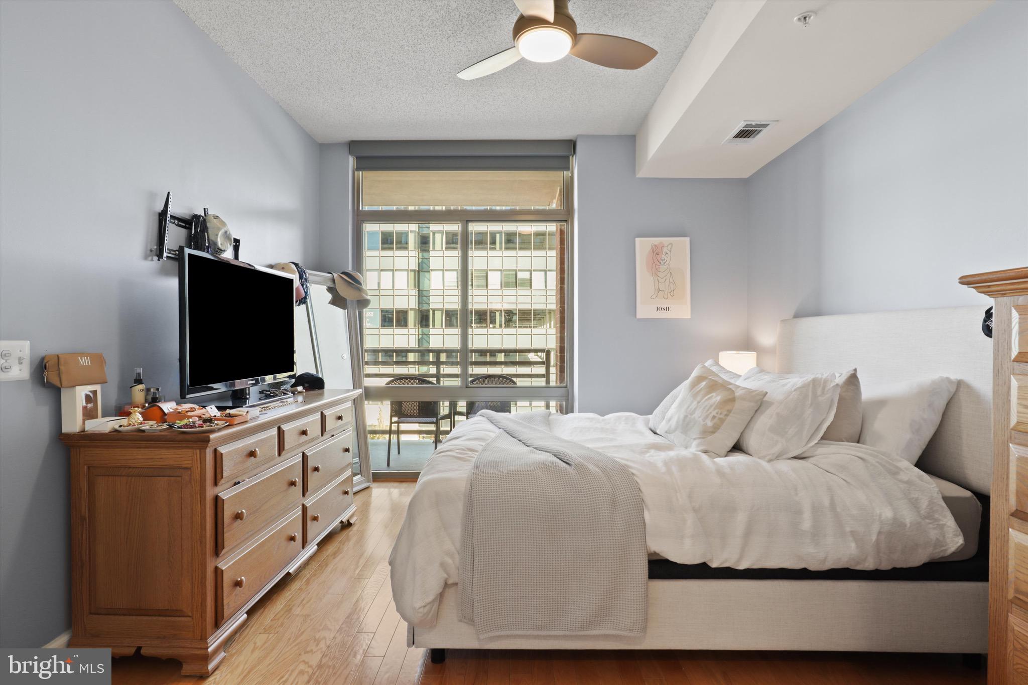 3600 South Glebe Road, Unit 414W Arlington, VA 22202 - Photo 12 of 60 a bedroom with a bed and a flat screen tv