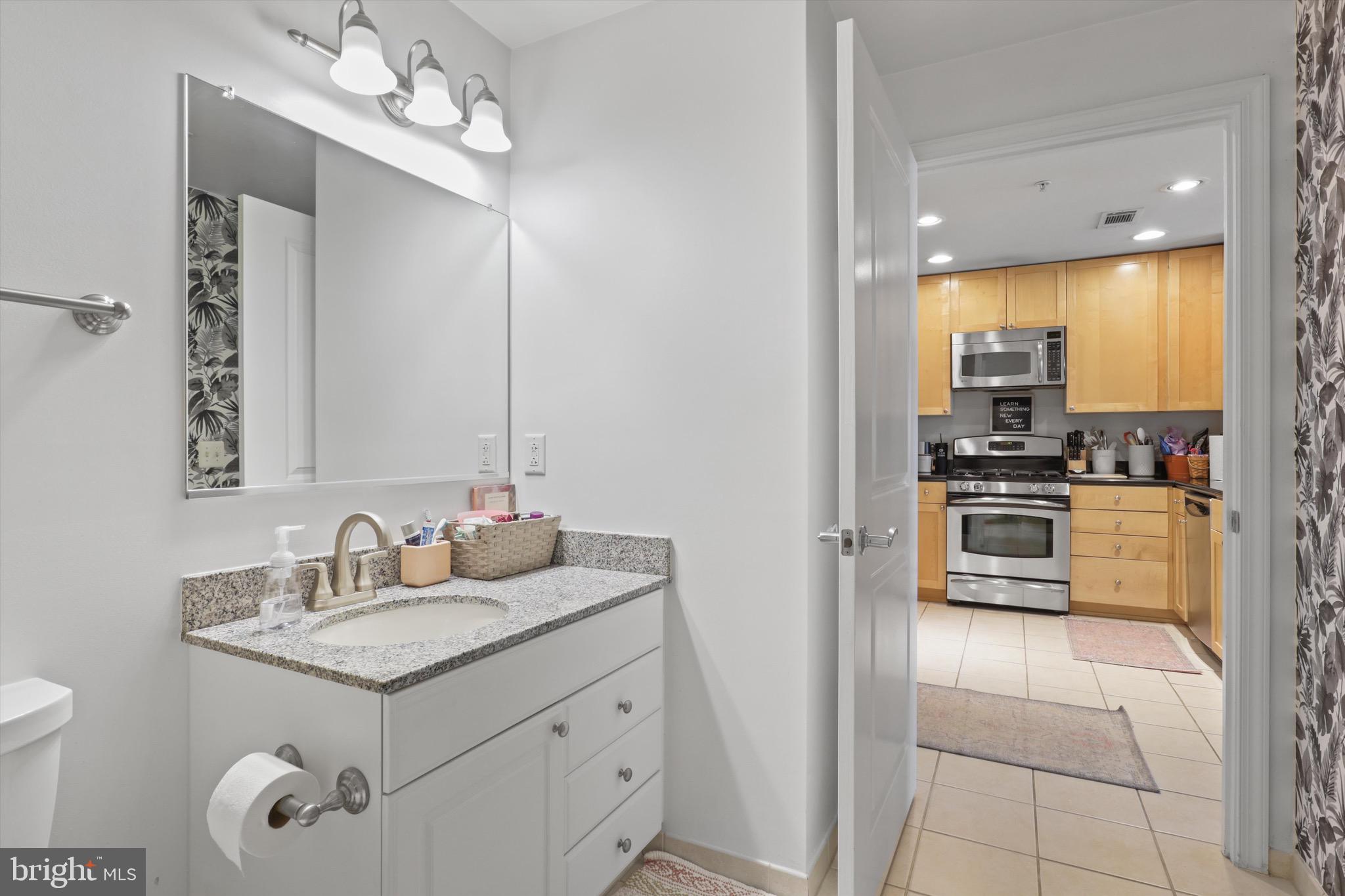 3600 South Glebe Road, Unit 414W Arlington, VA 22202 - Photo 21 of 60 a kitchen with a sink stove and refrigerator